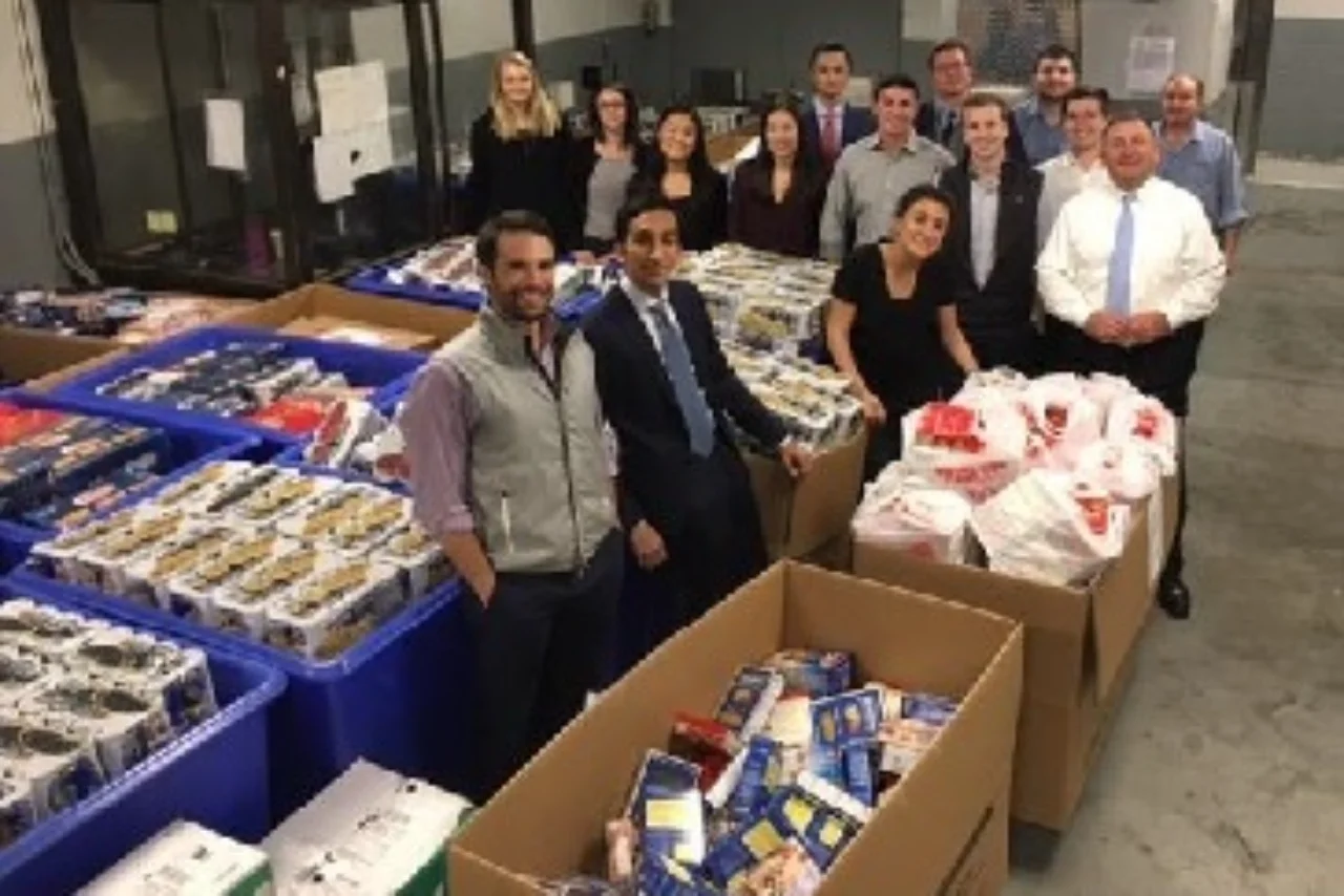 Employees prepare their food drive collection for pickup