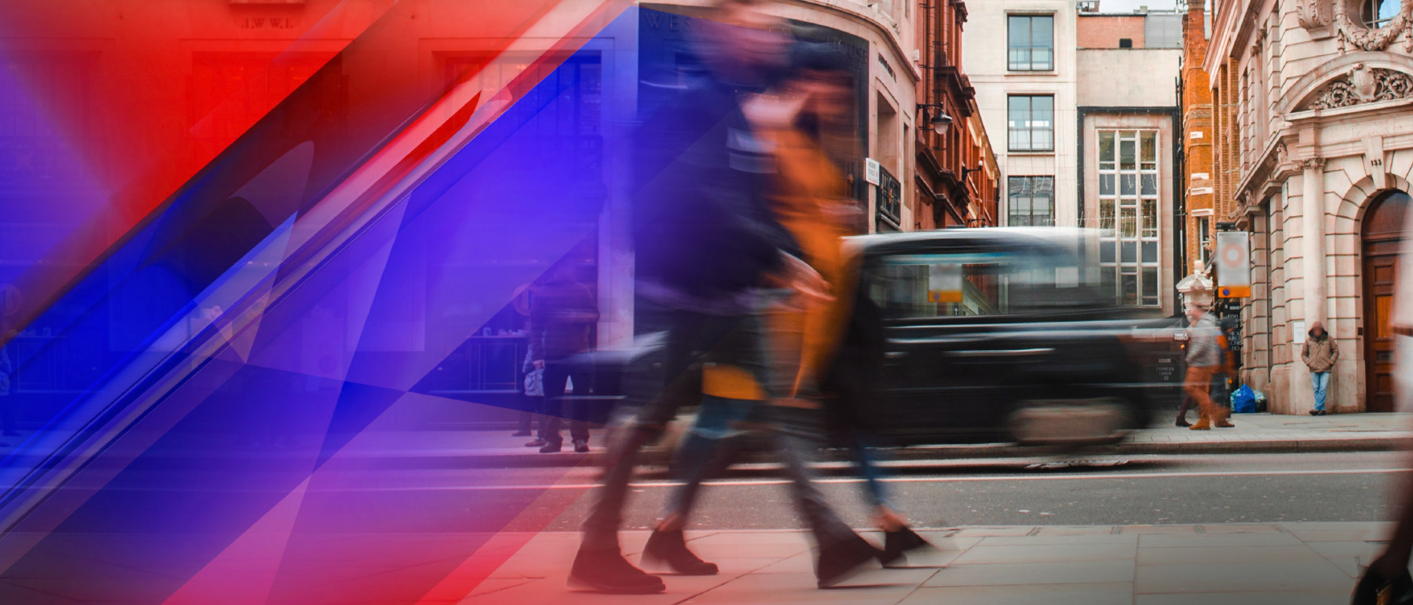 Pedestrians and traffic on a busy street in the City of London