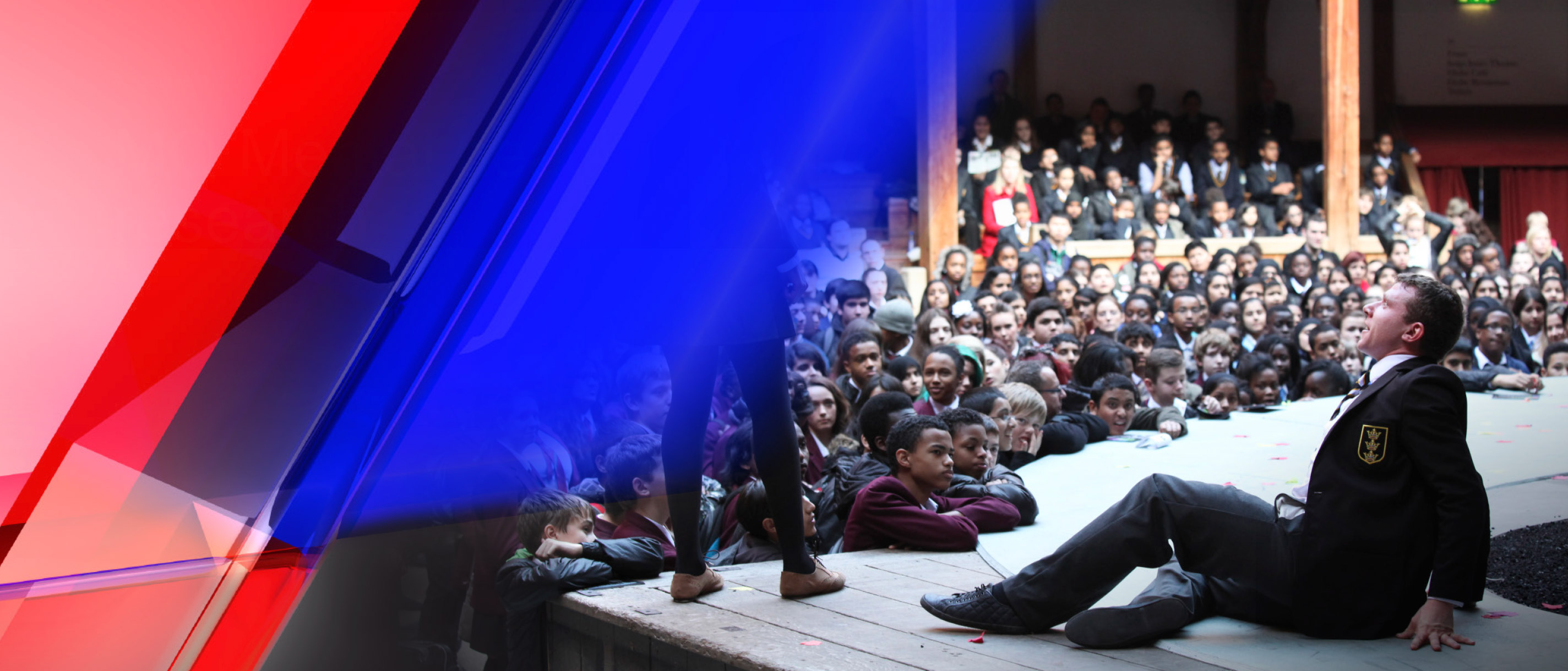 Teenagers in school uniform watch a performance at the Globe Theatre in London